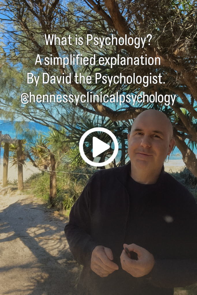 Thumbnail image of David the Psychologist standing on a coastal path with text reading What Is Psychology and a play button in the centre. Clicking the image opens the full video on the Hennessy Clinical Psychology Facebook page.