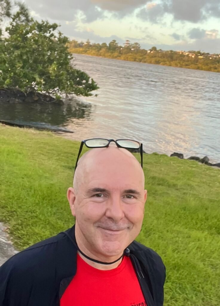 David Hennessy, Clinical Psychologist, outdoors beside the water