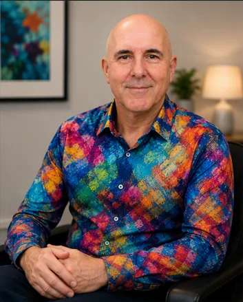 David Hennessy, Clinical Psychologist, seated in his consulting room
